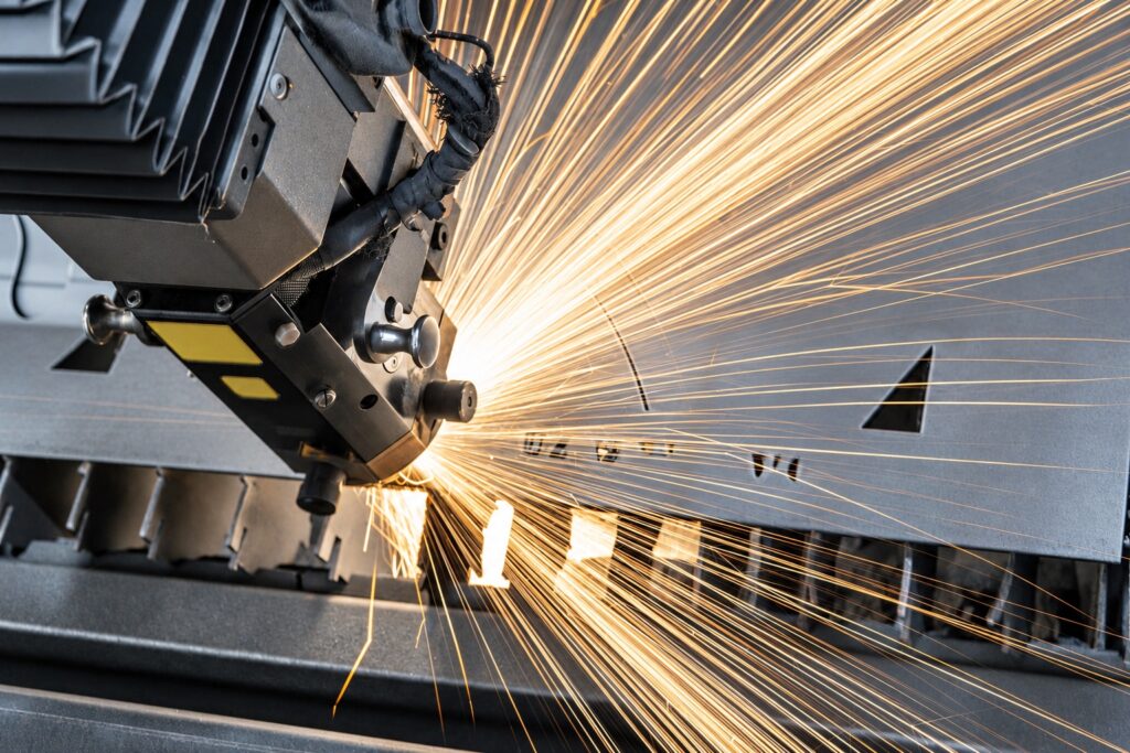 Industrial metalworking machinery producing sparks during processing